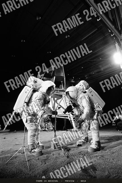 Apollo 11 crewmembers participates in simulation of moon's surface, vintage black and white photograph