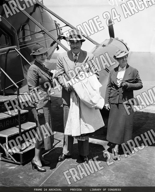 Group at airplane, vintage black and white photograph