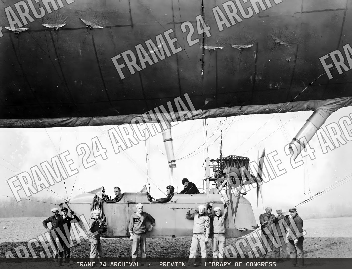 Group of men boarding an airship (1915), restored vintage black and white photograph