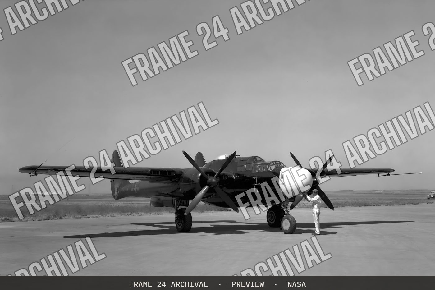 P-61A Airplane at NACA Ames Research Center, Moffett Field, California (1944), restored vintage black and white photograph