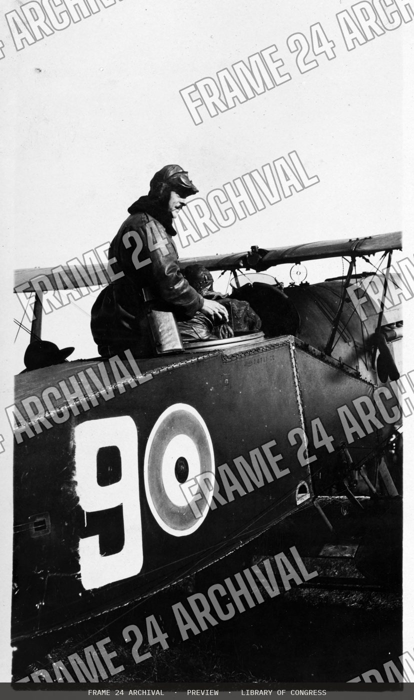 Pilot in an airplane (1920), restored vintage black and white photograph