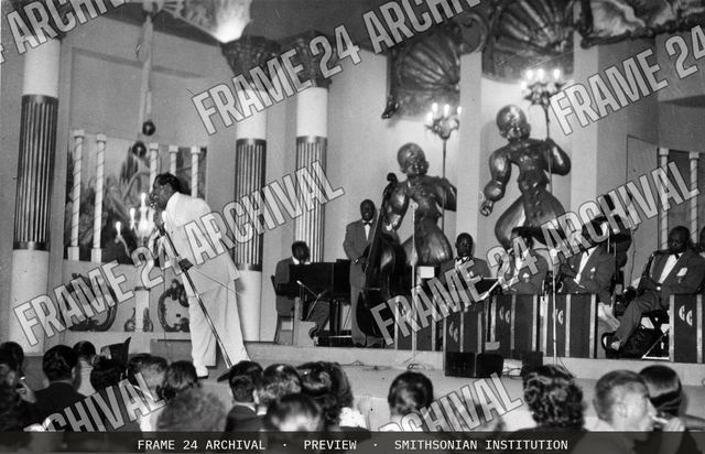 Print of Cab Calloway and his band performing on stage, vintage black and white photograph