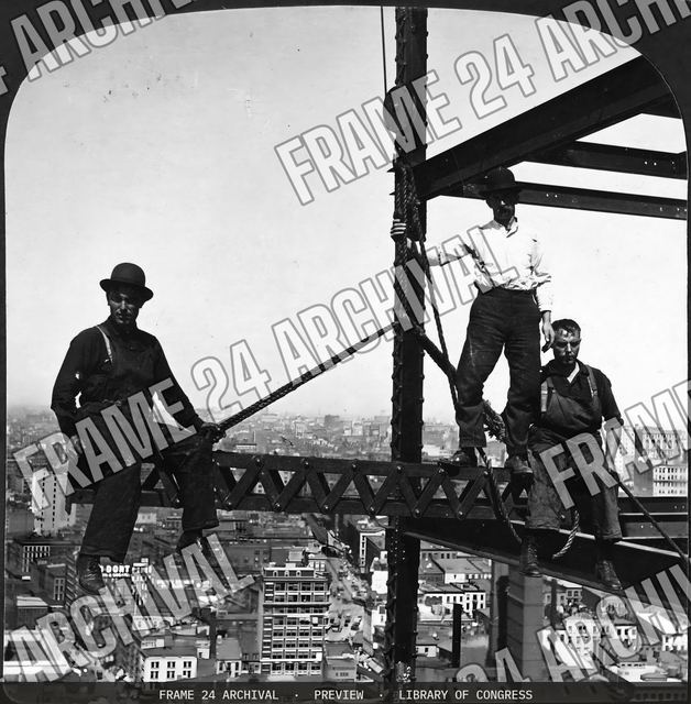Sailors on land--agile construction men on a suspended iron section, 200 ft. above ground, New York, vintage black and white photograph