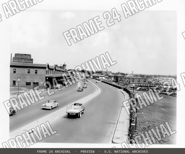 Six-lane divided city street, vintage black and white photograph